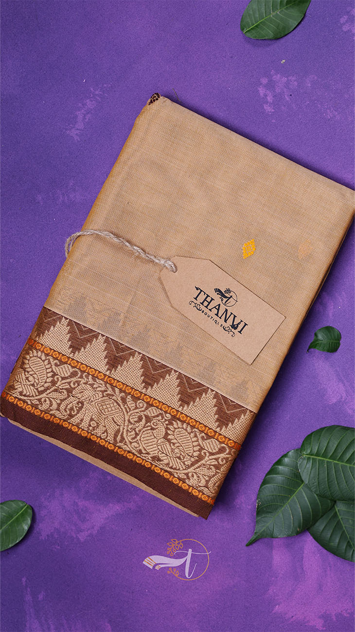 Brown notebook with decorative patterns and a tag on a purple background