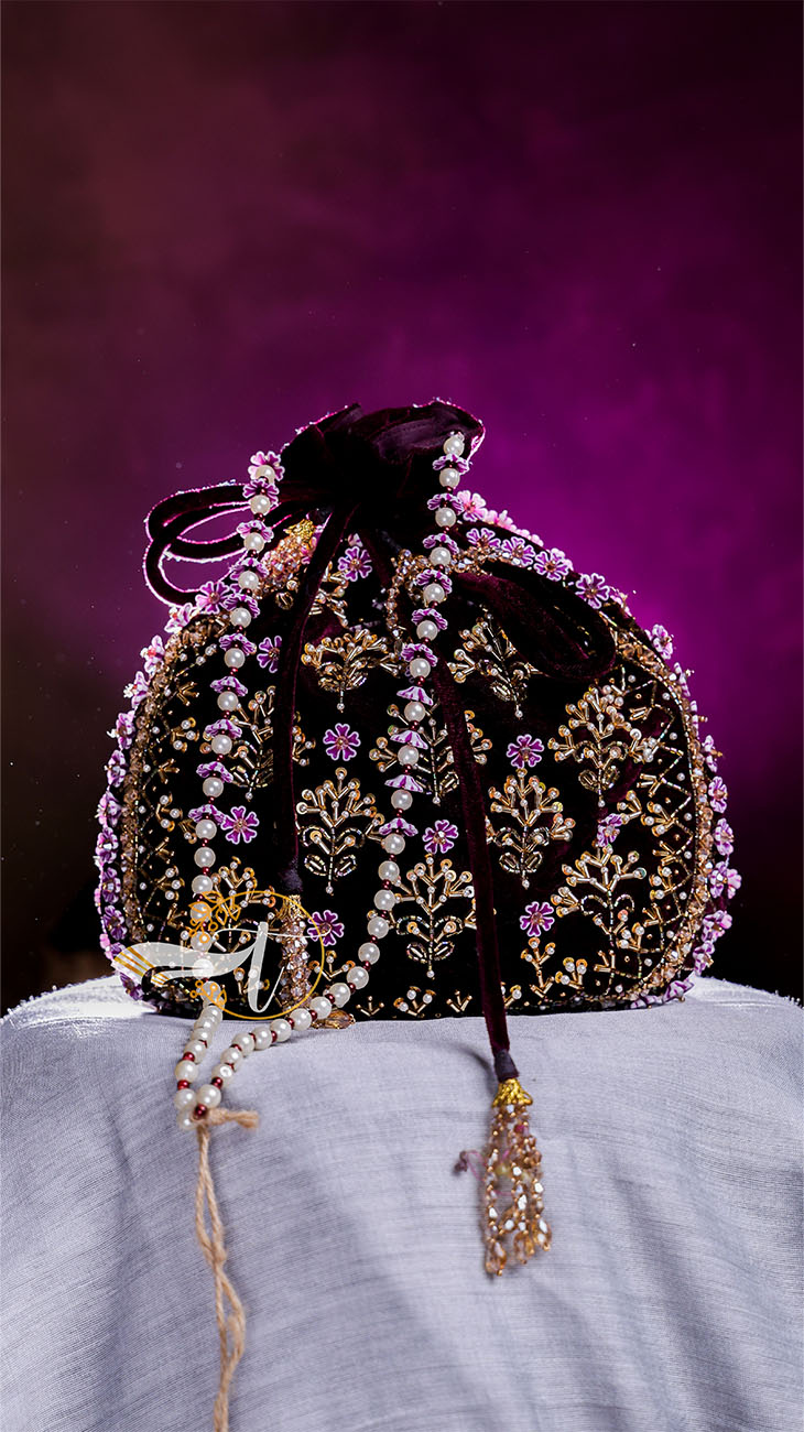 Decorative handbag with floral patterns on a purple background