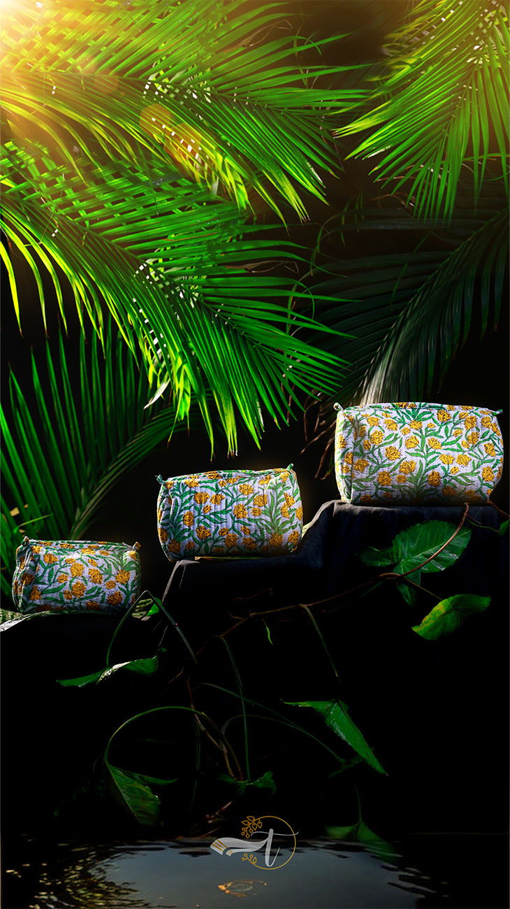 Decorative vases with floral patterns on a dark background with green foliage