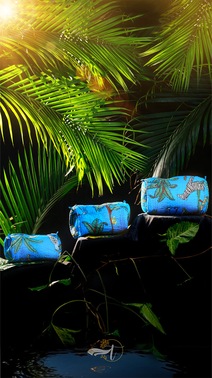 Blue pouches with zebra pattern on a rock surrounded by green foliage