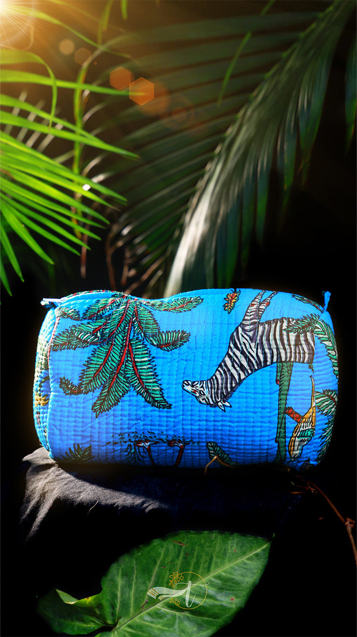 Blue pouch with animal pattern on a leafy background