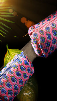 Close-up of pink and blue patterned fabric with a blurred background