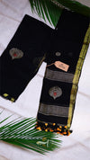 Black saree with gold and white patterns on a white background