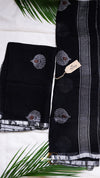 Black fabric with floral embroidery on a white background