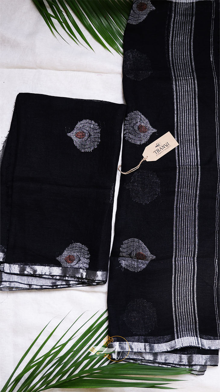 Black fabric with floral embroidery on a white background
