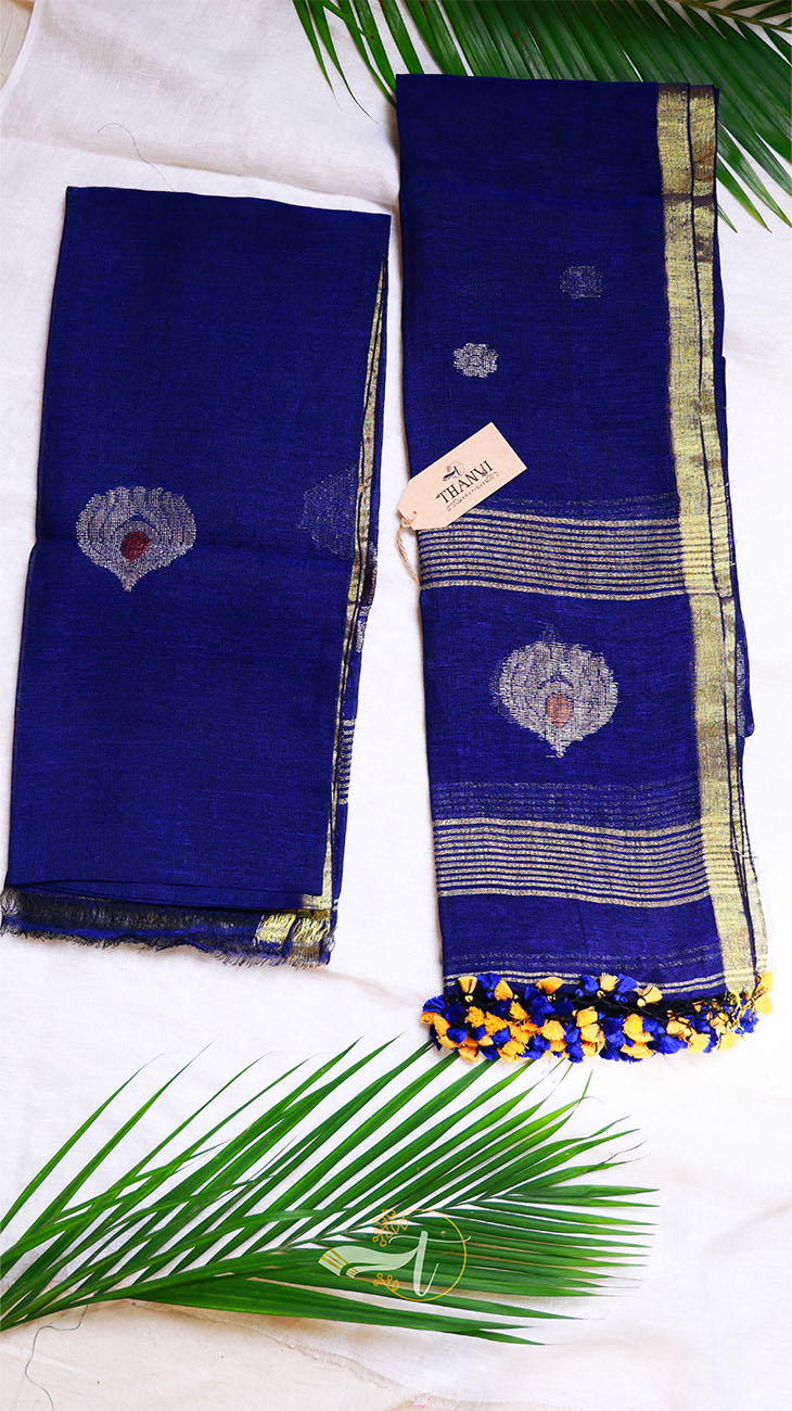 Blue saree with gold and white patterns on a white background