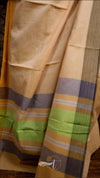 Beige fabric with colorful stripes on a wooden surface