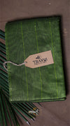 Green fabric with a 'THANVI' tag on a brown background