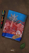 Decorative notebook with floral design on a brown background