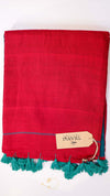 Red towel with teal tassels and a brand tag on a white background