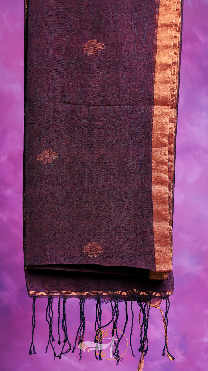 Dark brown scarf with gold border and tassels on a purple background