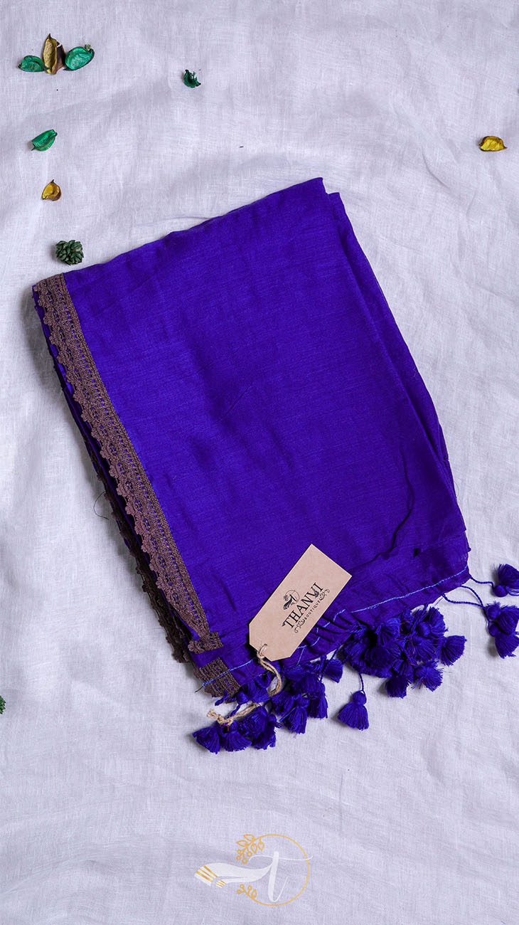Purple scarf with tassels on a light gray background