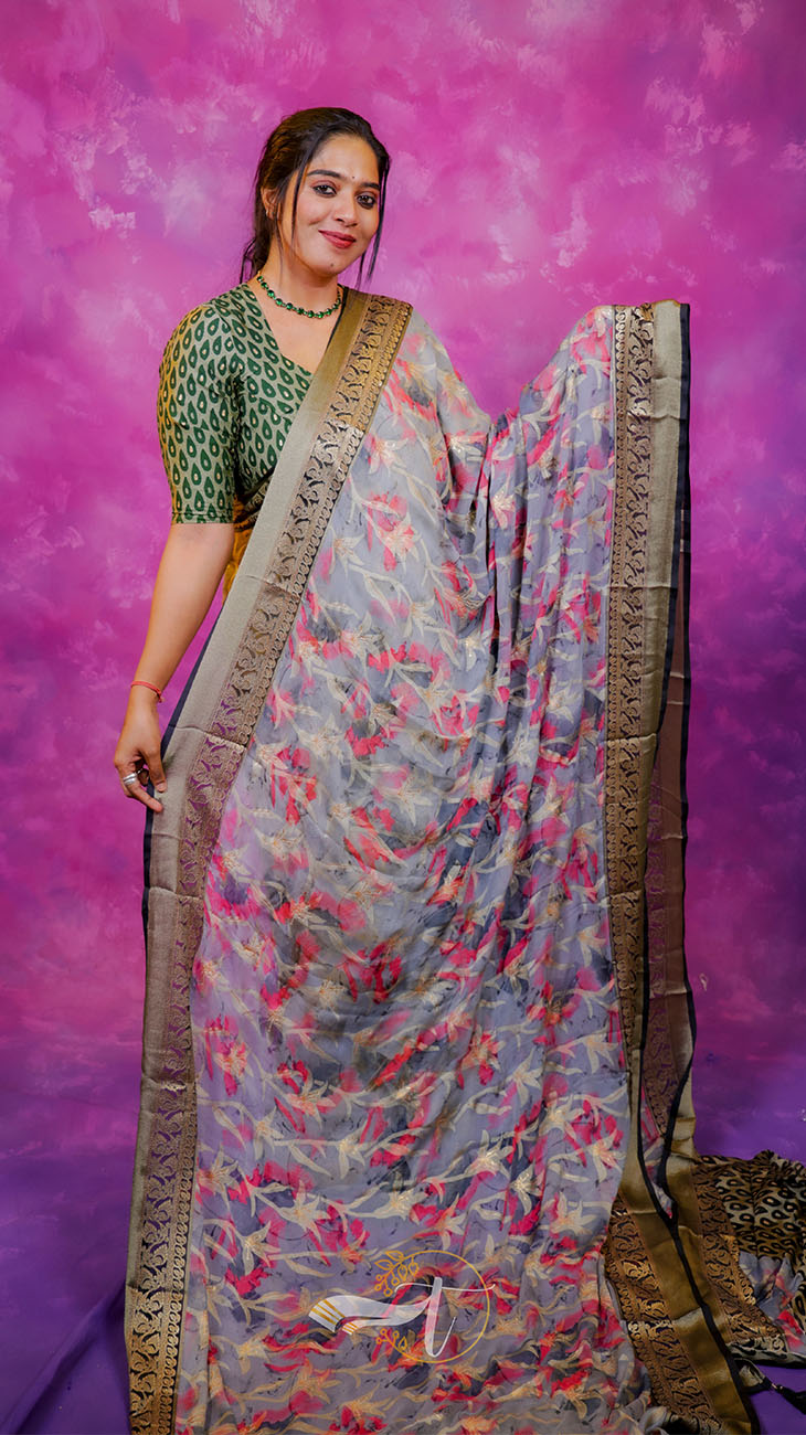Woman wearing a floral saree with a purple background