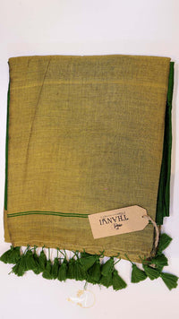 Green fabric with tassels and a visible brand tag on a white background