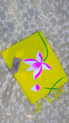 Yellow scarf with pink flower design on a textured surface