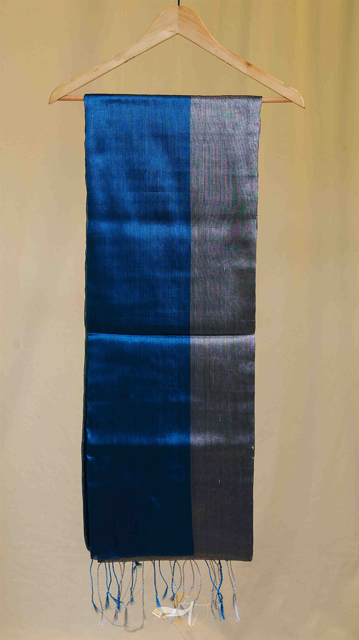 Blue and gray striped scarf on a wooden hanger against a beige background