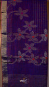 Purple fabric with floral patterns and a logo in the corner