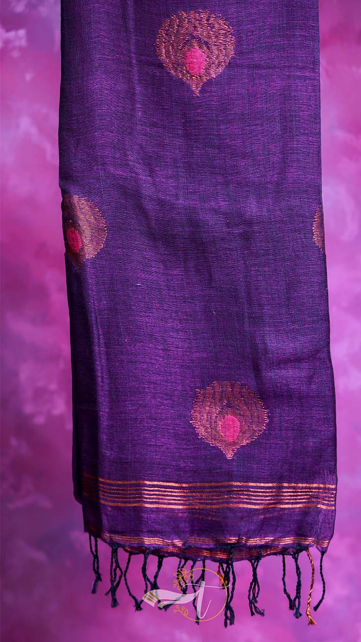 Purple scarf with pink floral patterns and black tassels on a pink background