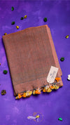 Brown fabric with decorative elements on a purple background