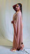 Woman wearing a pink saree with a white background