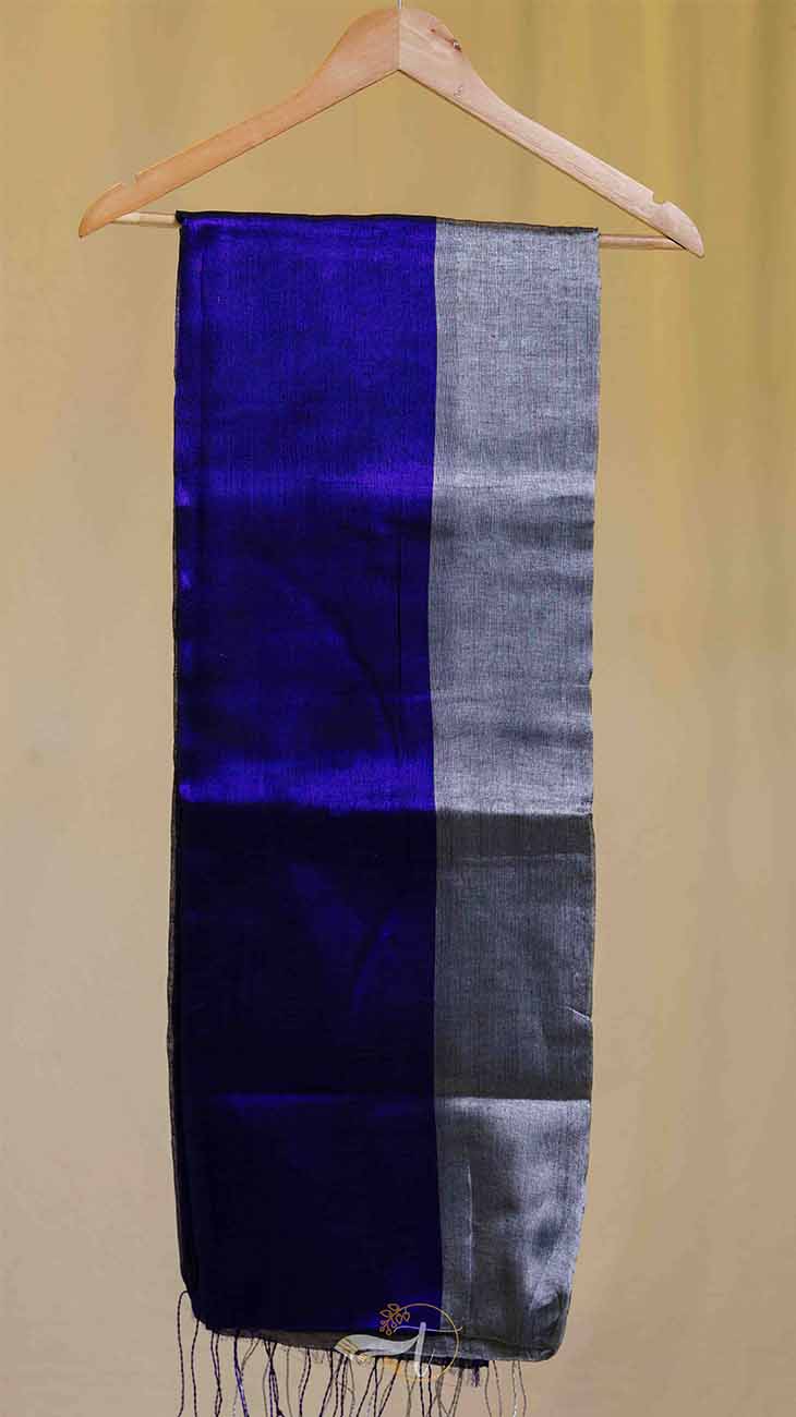 Blue and gray striped fabric on a hanger against a beige background