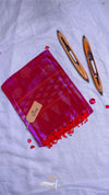 Red fabric pouch with tassels and a tag on a light gray background