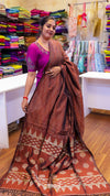 Woman wearing a traditional saree in a store setting
