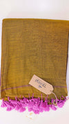 Mustard yellow towel with pink tassels and a visible brand tag on a white background