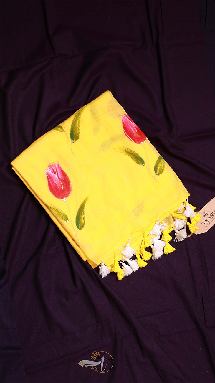 Yellow fabric with floral patterns on a dark purple background