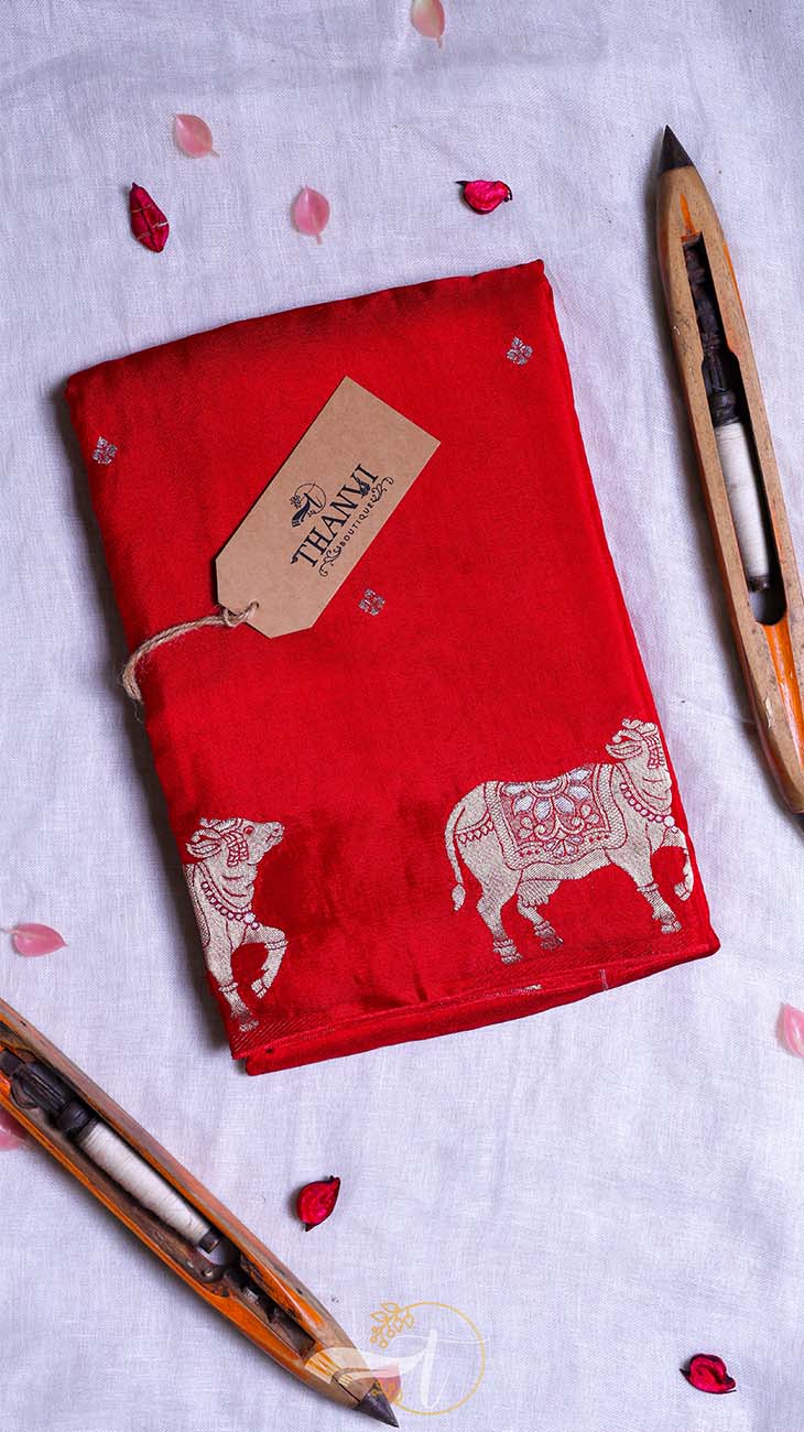 Red fabric with white bull patterns and a 'Team' tag on a light gray background.
