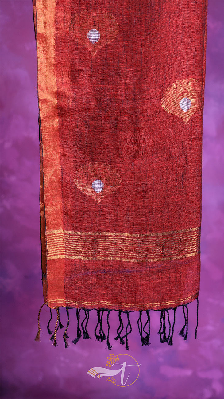 Red fabric with gold patterns on a purple background