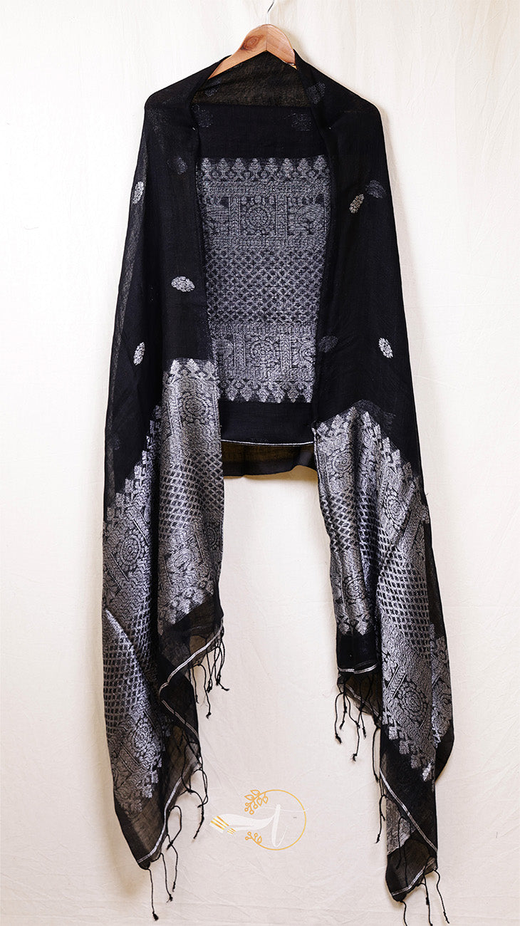 Black and white patterned scarf on a hanger against a white background