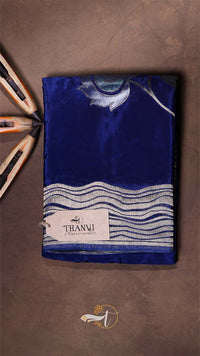 Blue fabric with white patterns on a brown background, featuring the 'THANVI' brand.