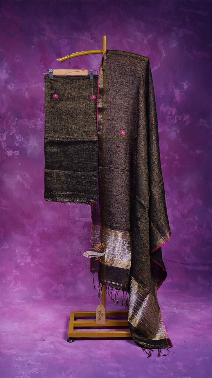 Textile on a wooden stand against a purple background