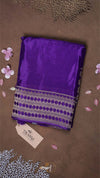 Purple fabric with a pattern on a brown background
