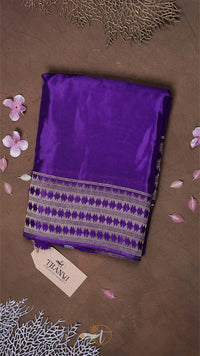 Purple fabric with a pattern on a brown background