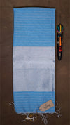 Blue and gray striped towel with a tag on a brown background