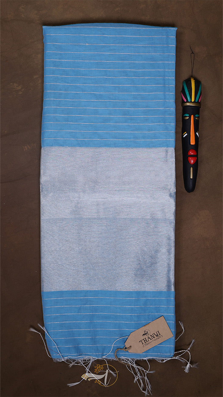 Blue and gray striped towel with a tag on a brown background