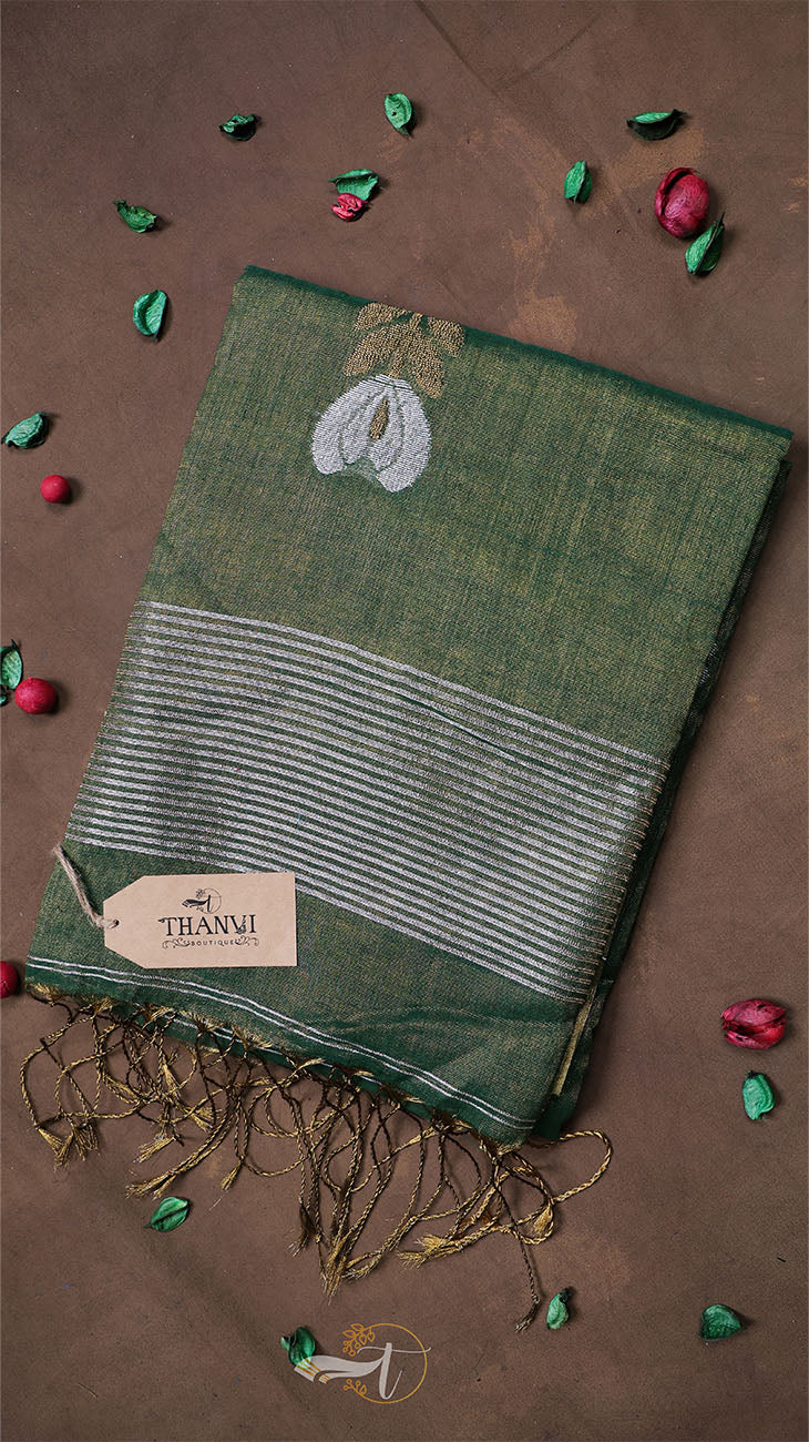 Green scarf with embroidered design on a brown background