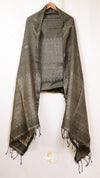 Dark green patterned scarf with fringes on a white background