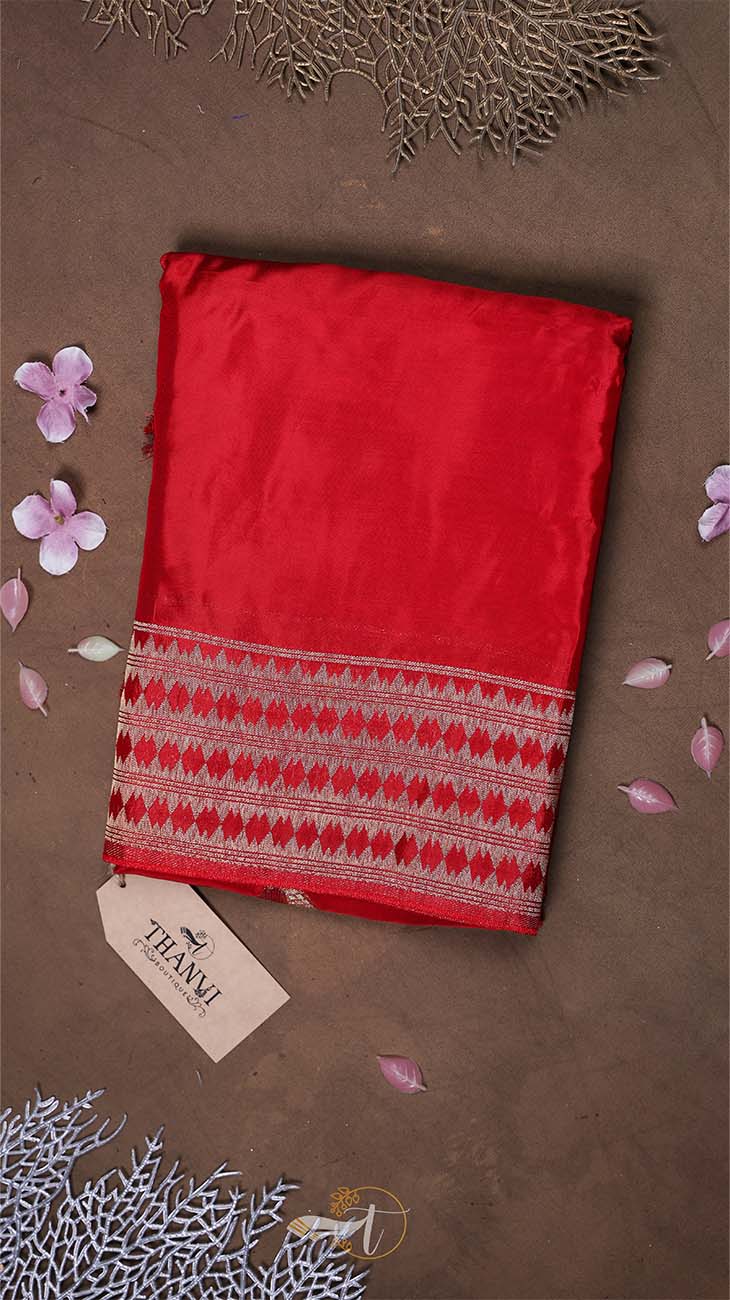Red fabric with a pattern on a brown background