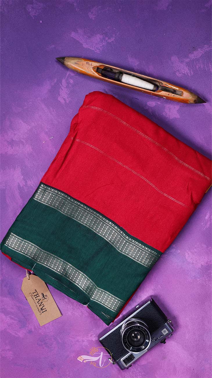 Red and green fabric with a knife and camera on a purple background