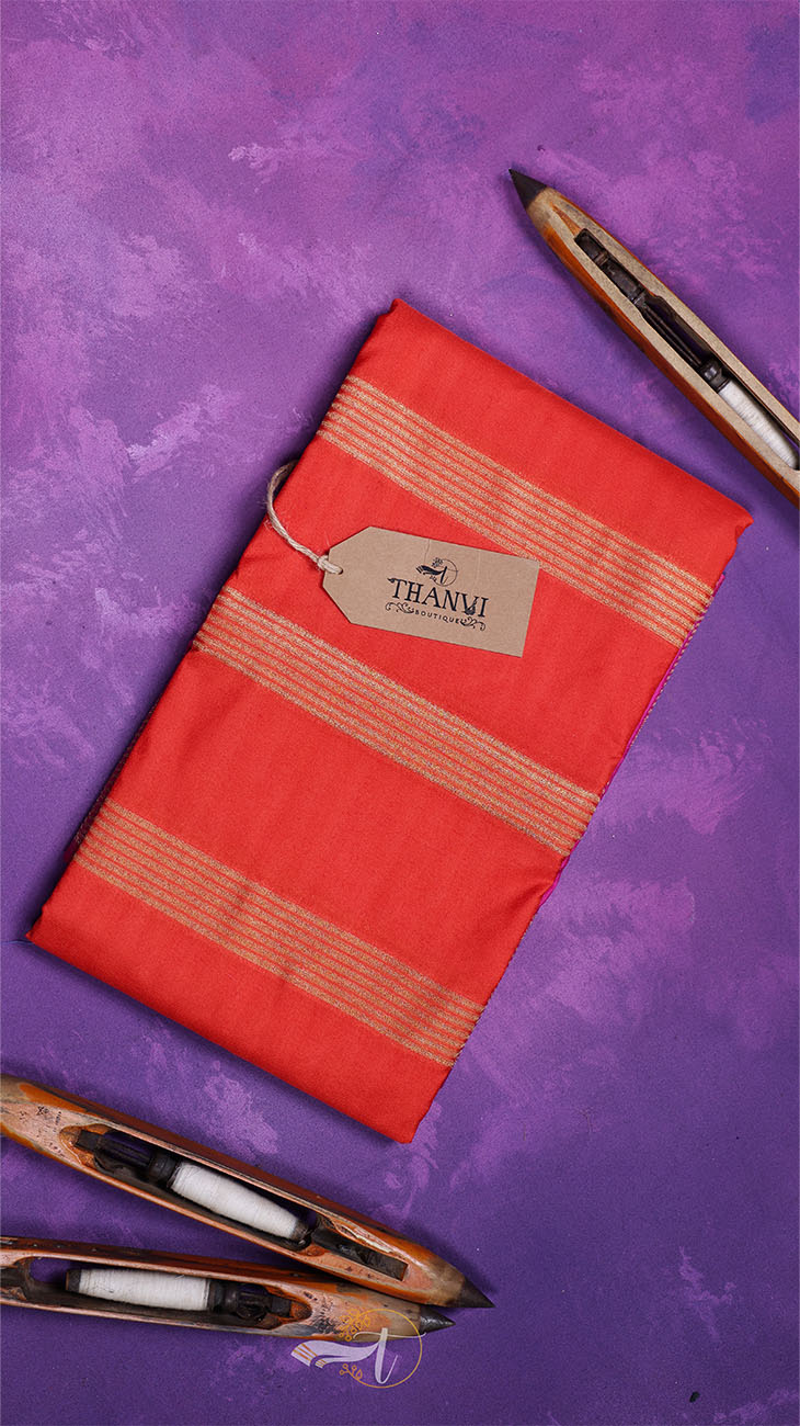 Red fabric with a 'THANVI' tag on a purple background