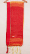 Red saree with yellow border and tassels on a white background