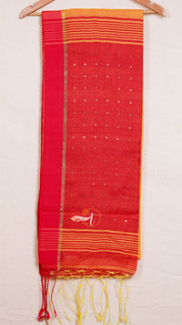 Red saree with yellow border and tassels on a white background