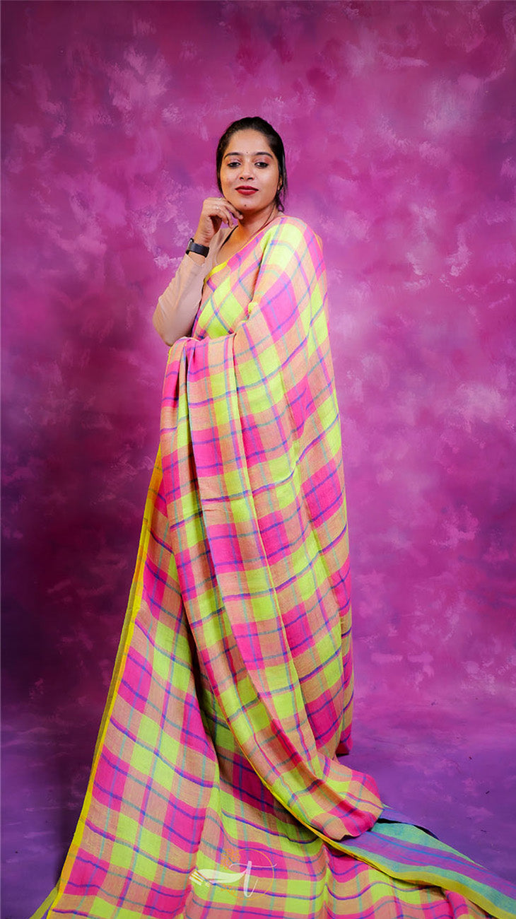 Woman wearing a colorful saree against a purple background