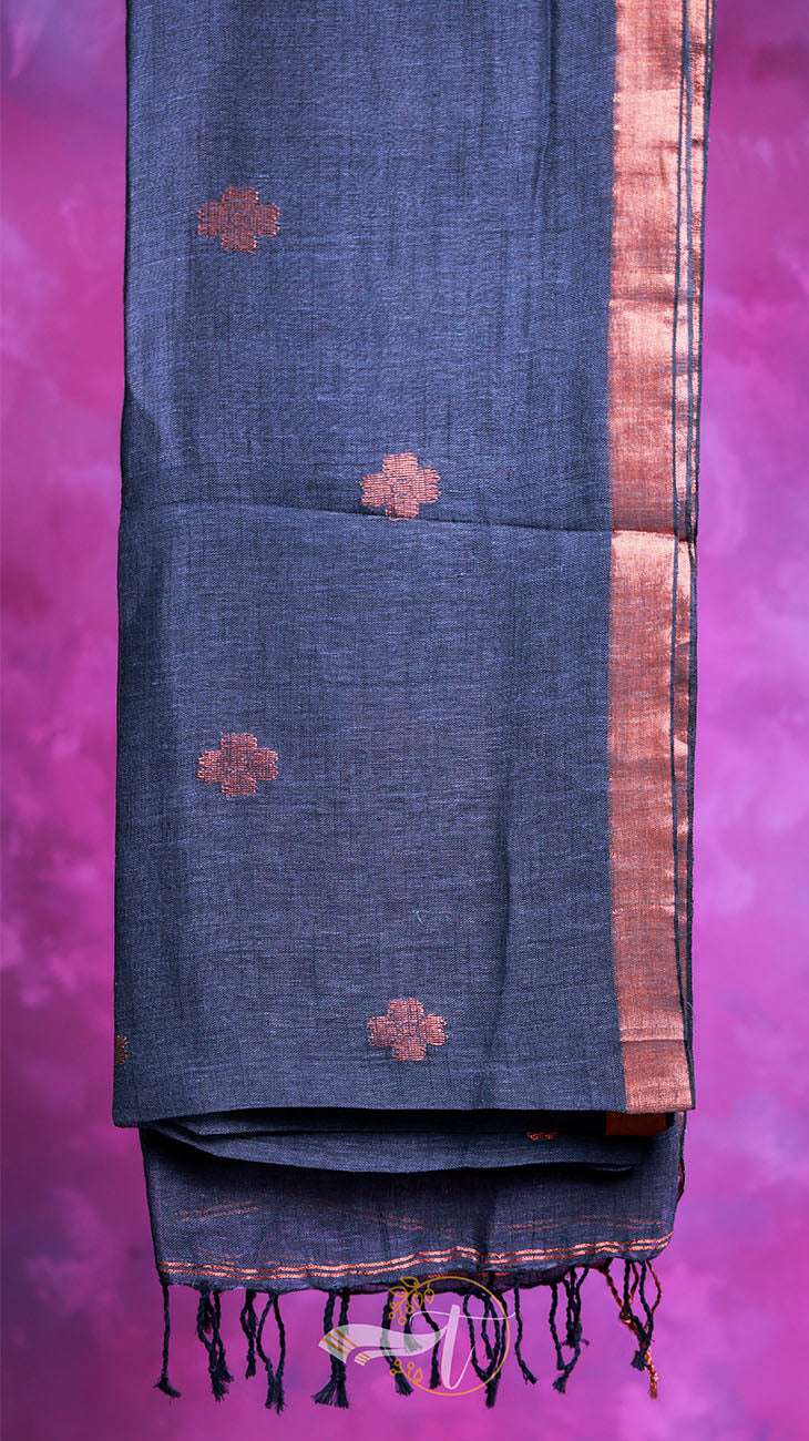 Blue fabric with red floral patterns and black tassels on a purple background
