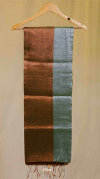 Brown and green striped scarf on a hanger against a beige background