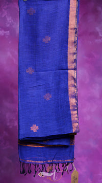 Blue fabric with gold patterns on a purple background