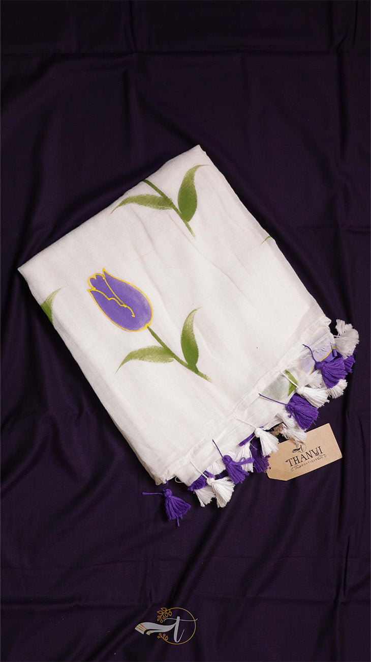 White scarf with purple tulip design on a dark fabric background